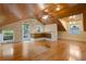 Spacious bonus room features a wood-paneled ceiling, hardwood floors, and a cozy atmosphere at 525 Sheridan Blvd, Orlando, FL 32804