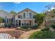 A two-story home features a balcony, lush landscaping, and a walkway at 525 Sheridan Blvd, Orlando, FL 32804