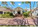 Beautiful home featuring a classic design, lush landscaping, and inviting front entrance at 525 Sheridan Blvd, Orlando, FL 32804