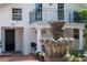 A stone fountain graces the front of the house, adding charm to the property at 525 Sheridan Blvd, Orlando, FL 32804