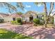 Charming home with brick drive, covered entry, beautiful landscaping, and a cozy, inviting appeal at 525 Sheridan Blvd, Orlando, FL 32804