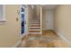 Hallway features a staircase, patterned tile flooring and a glass-paneled exterior door at 525 Sheridan Blvd, Orlando, FL 32804