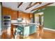 Spacious eat-in kitchen featuring exposed ceiling beams and stainless appliances at 525 Sheridan Blvd, Orlando, FL 32804