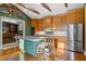 Open-concept kitchen featuring stainless appliances and large central island at 525 Sheridan Blvd, Orlando, FL 32804