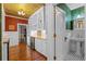 Bright kitchen boasts butcher block counters, custom cabinets, wine fridge, and stylish design elements at 525 Sheridan Blvd, Orlando, FL 32804