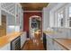 Charming galley kitchen with butcher block countertops and butler's pantry at 525 Sheridan Blvd, Orlando, FL 32804