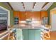 Large kitchen island with marble countertop and room for seating at 525 Sheridan Blvd, Orlando, FL 32804
