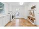 Bright laundry room with a mudroom area, plenty of cabinets and stainless steel appliances at 525 Sheridan Blvd, Orlando, FL 32804