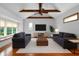 Bright living room features vaulted ceiling, exposed beams, and comfortable seating at 525 Sheridan Blvd, Orlando, FL 32804