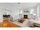 Bright living room with fireplace, built-in shelves, and hardwood floors at 525 Sheridan Blvd, Orlando, FL 32804