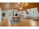Office space features a vaulted ceiling, hardwood floors, an exterior door and multiple windows at 525 Sheridan Blvd, Orlando, FL 32804