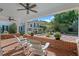 Outdoor patio with brick floor and view of the beautifully landscaped backyard at 525 Sheridan Blvd, Orlando, FL 32804
