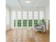 Bright sun room with tile floors, and seating area at 525 Sheridan Blvd, Orlando, FL 32804
