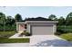 Charming single-story home with a two-car garage, manicured lawn, and inviting curb appeal at 5535 Maddie Dr, Haines City, FL 33844