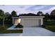 Charming single-story home with a two-car garage, manicured lawn, and inviting curb appeal at 5535 Maddie Dr, Haines City, FL 33844