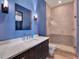 Stylish bathroom featuring a custom vanity, sleek fixtures, and a walk-in shower at 6137 Grosvenor Shore Dr, Windermere, FL 34786