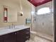 Modern bathroom with custom vanity, walk-in shower, and contemporary fixtures at 6137 Grosvenor Shore Dr, Windermere, FL 34786