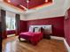 Stylish bedroom featuring a contemporary design, bright lighting, and hardwood floors at 6137 Grosvenor Shore Dr, Windermere, FL 34786