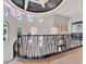 Hallway featuring a stylish railing, decorative lighting, and views of the property at 6137 Grosvenor Shore Dr, Windermere, FL 34786
