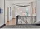 Hallway with designer carpet, decorative lighting, and architectural features that create a luxury aesthetic at 6137 Grosvenor Shore Dr, Windermere, FL 34786