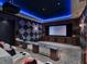 Luxury home theater featuring tiered seating, a projector, and unique starry night ceiling at 6137 Grosvenor Shore Dr, Windermere, FL 34786