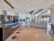 Open concept kitchen with stainless steel appliances and breakfast bar overlooking the living area at 6137 Grosvenor Shore Dr, Windermere, FL 34786