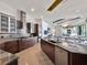 Open-concept kitchen with modern cabinetry, stainless steel appliances, and a large island at 6137 Grosvenor Shore Dr, Windermere, FL 34786