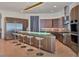 Modern kitchen with stainless steel appliances, breakfast bar and plenty of counter space at 6137 Grosvenor Shore Dr, Windermere, FL 34786