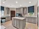 Large laundry room features custom cabinets and an island workspace at 6137 Grosvenor Shore Dr, Windermere, FL 34786