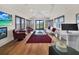 Sun-filled living room boasting high ceilings and scenic backyard views at 6137 Grosvenor Shore Dr, Windermere, FL 34786