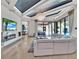 Bright living room with modern fireplace and access to the patio at 6137 Grosvenor Shore Dr, Windermere, FL 34786