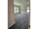 Bedroom with neutral walls and plush carpet, and windows offering natural light at 8243 Fenton St, Orlando, FL 32836