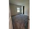 Bedroom with large window, carpeted floor, and ample closet space at 8243 Fenton St, Orlando, FL 32836