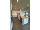 Spacious kitchen with an island, stainless steel appliances, and white cabinets at 8243 Fenton St, Orlando, FL 32836