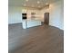 Modern kitchen features white cabinets, stainless steel appliances, and a center island at 8243 Fenton St, Orlando, FL 32836