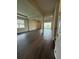 Open living room with dark wood floors, recessed lighting, and bright windows offers scenic views at 8243 Fenton St, Orlando, FL 32836