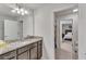 Bright bathroom features granite countertops and a view into a bedroom at 8840 Bengal Ct, Kissimmee, FL 34747