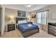 Comfortable bedroom features a modern bed frame, matching nightstands, and modern art at 8840 Bengal Ct, Kissimmee, FL 34747