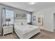 Bright bedroom with a white framed bed, soft carpet, and ensuite bathroom access at 8840 Bengal Ct, Kissimmee, FL 34747