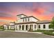 Beautiful community clubhouse with Mediterranean-style architecture at sunset at 8840 Bengal Ct, Kissimmee, FL 34747