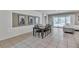 Bright dining area with a sliding glass door with a view of the backyard, and modern decor at 8840 Bengal Ct, Kissimmee, FL 34747