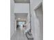 Bright foyer with soaring ceilings leads to an open-concept living space, with stairs to the second level at 8840 Bengal Ct, Kissimmee, FL 34747