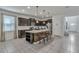 Modern kitchen with a center island, granite countertops, and stainless steel appliances at 8840 Bengal Ct, Kissimmee, FL 34747