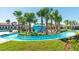 Beautiful lazy river surrounded by lush landscaping and palm trees at community pool at 8840 Bengal Ct, Kissimmee, FL 34747
