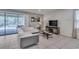 Comfortable living room featuring sliding glass doors to the pool area, and contemporary decor at 8840 Bengal Ct, Kissimmee, FL 34747