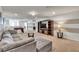 Spacious living room features a foosball table, comfortable seating, and large TV at 8840 Bengal Ct, Kissimmee, FL 34747