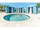 Community hot tub with surrounding cabanas for shade and relaxation by the pool at 8840 Bengal Ct, Kissimmee, FL 34747