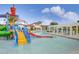 Colorful community water park area with slides and lounge seating by pool at 8840 Bengal Ct, Kissimmee, FL 34747