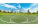 Outdoor basketball court with green surface and clear markings for recreational games and practice at 9004 Sunshine Ridge Loop, Kissimmee, FL 34747
