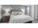 Cozy bedroom featuring decorative mirrors, neutral color palette, and comfortable furnishings at 9004 Sunshine Ridge Loop, Kissimmee, FL 34747